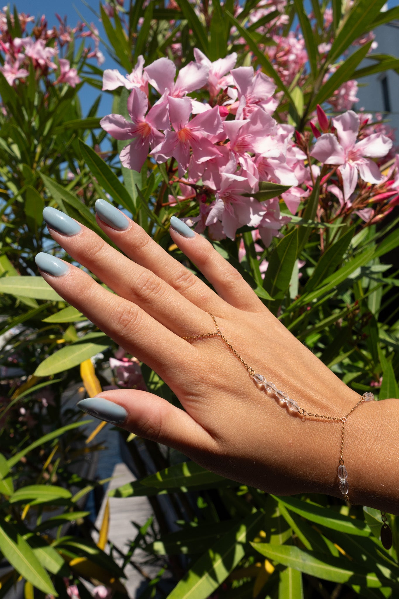 Capri hand chain helder - gold plated