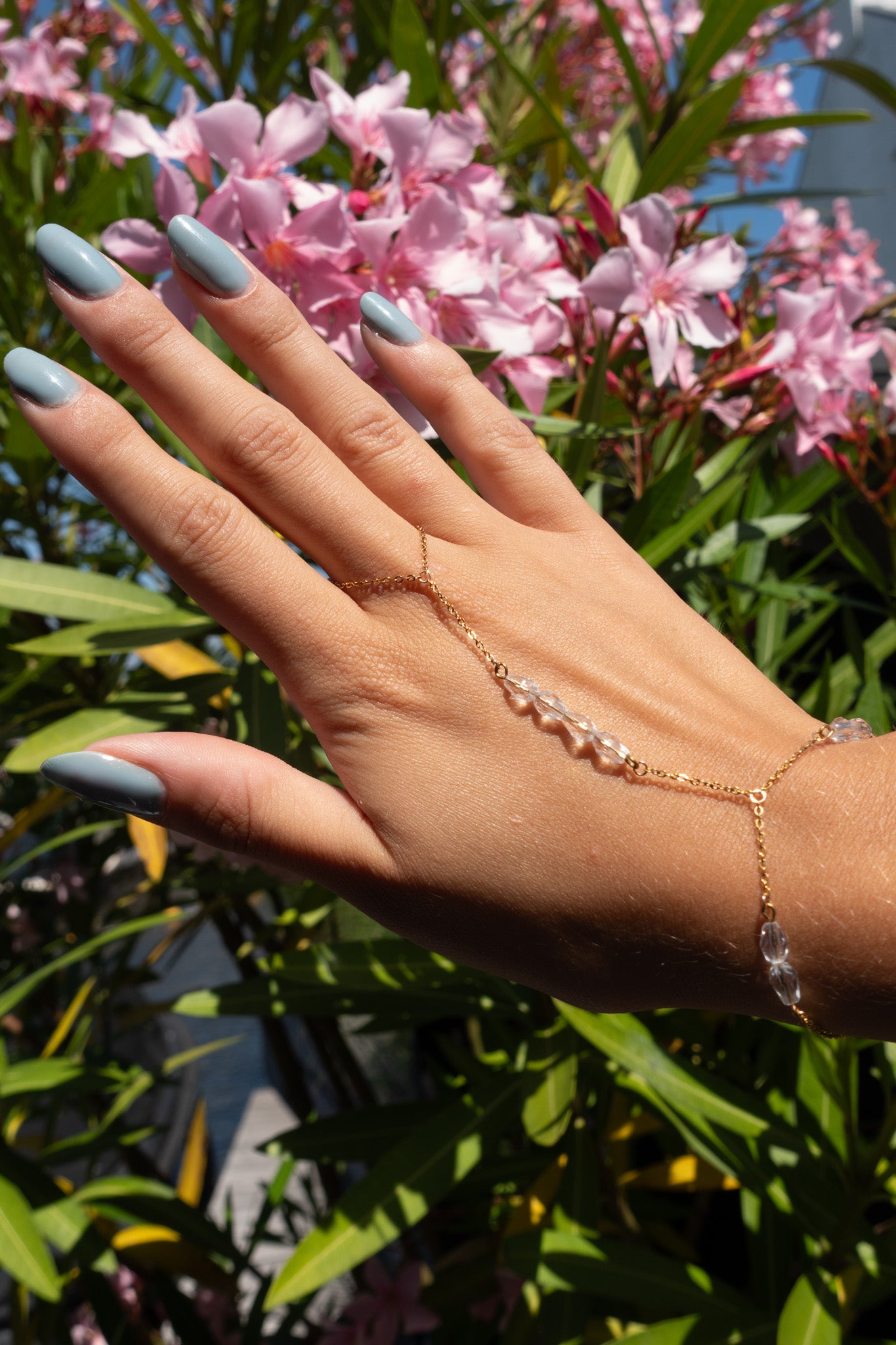 Capri hand chain helder - gold plated
