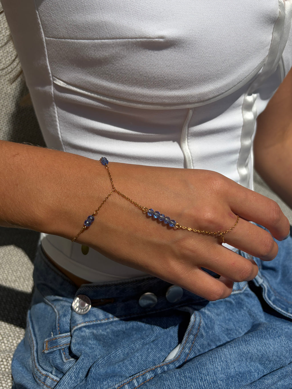 Capri hand chain blauw - gold plated